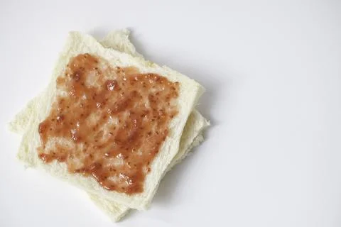 Close-up of white bread with raspberry jam Stock Photos