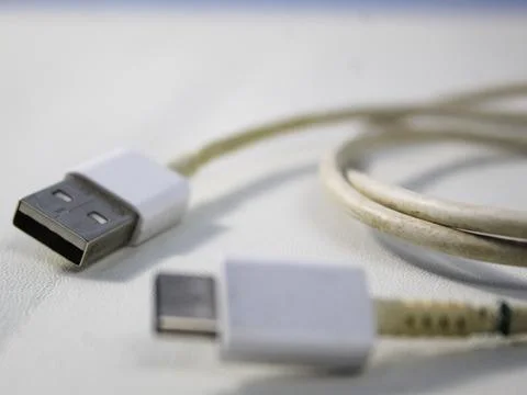 Close up the white broken smartphone usb cable Stock Photos