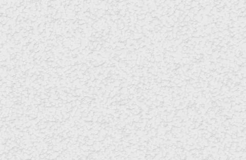 Close up of white bumpy plaster wall texture with small scattered raised dots. Illustrazione stock