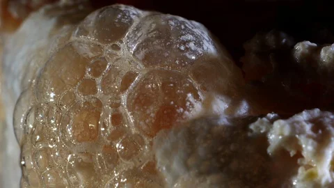Close up of white bursting bubbles from a magic potion or a futuristic drink Stock-Footage 107346631