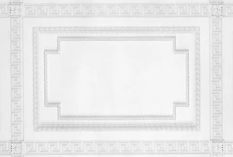 Close-up of a white ceiling featuring a Greek key border and blank copy spa.. Stock Photos