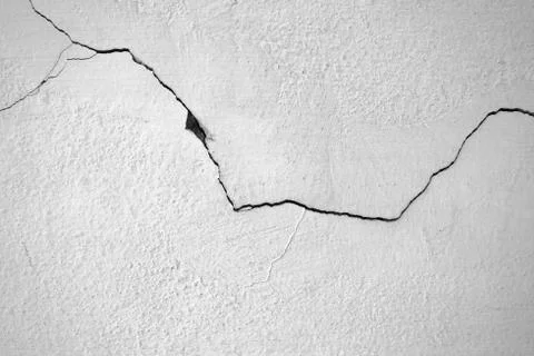 Close-up of White cement crack wall and peeled paint caused by water and sunl Stock Photos