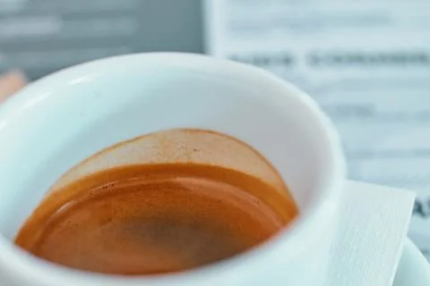 Close-up of a white ceramic cup filled with fresh aromatic espresso coffee Stock Photos