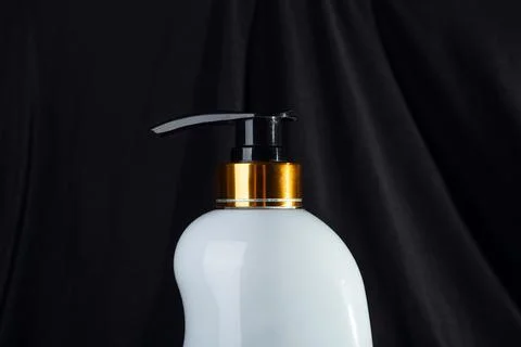 Close up White ceramic opaque bottle on black background without labels on .. Stock Photos