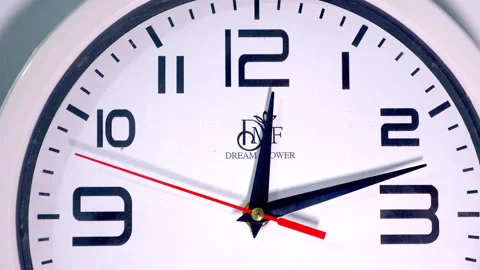 Close-Up of a White Circular Clock With a Red Second Hand Stock Footage 337396997
