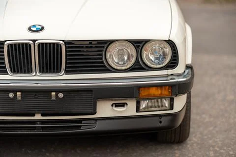 Close up of white classic BMW E30 car. Stock Photos