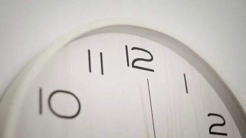 Close up white clock with big black numbers dial. Modern design Stock Footage 81664642