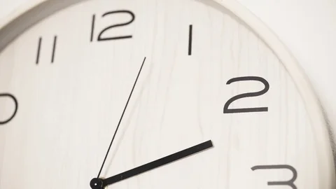 Close up white clock with big black numbers dial. Modern design Stock Footage 81664763