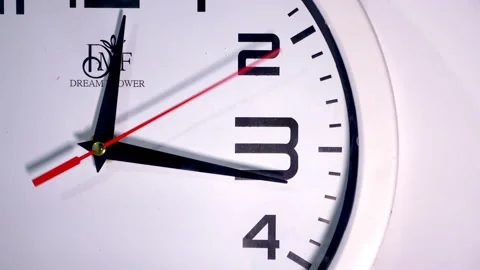 Close-Up of White Clock with Red Second Hand Sweeping 15 Seconds Stock Footage 337400879
