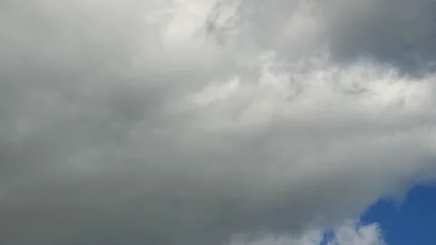 Close-up of white cloud in blue sky that is moving to the right  Stock Footage 229825335