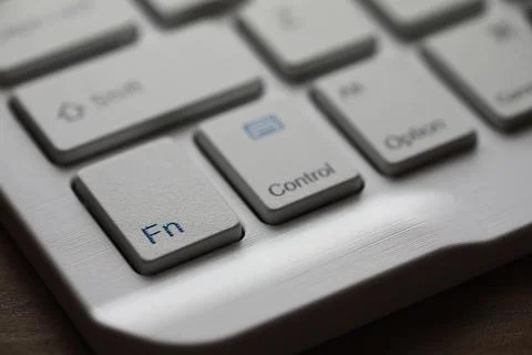 Close-Up of White Computer Keyboard with Focus on Function and Control Keys 库存照片