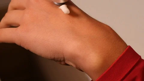 Close up of white cream on a woman's hand Stock Footage 101238954