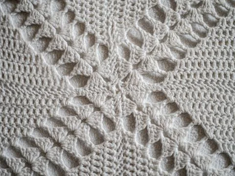 Close up of white crocheted fabric pattern in a cross Stock Photos