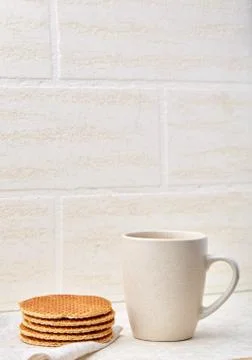 Close-up white cup of coffee with waffles on white background, top view Stock Photos