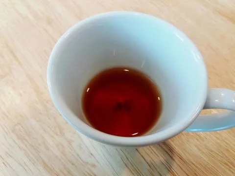 Close up white cup of tea or coffee on the wooden table or wood background Stock Photos