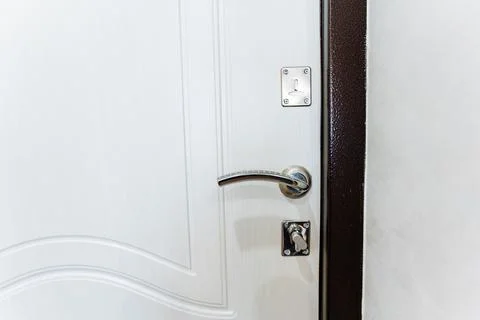 Close up of a white door with a handle, made of metal fixture Photos