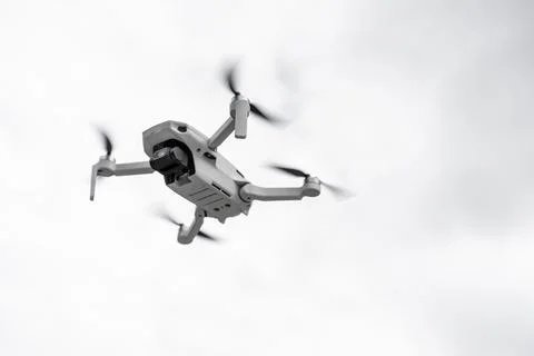Close-up of a white drone with the propellers working Stock Photos