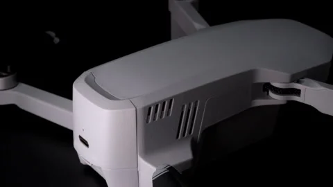 Close-Up of a White Drone With USB Port on Black Background During Daytime Stock Footage 276297681
