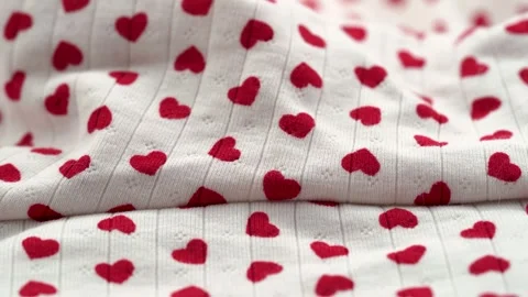 Close up of white fabric with red heart pattern and textile texture Stock Footage 331696859