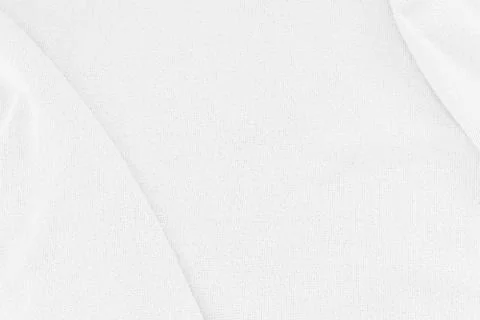 Close-up of white fabric texture background. Abstract crumpled cloth. Stock Photos