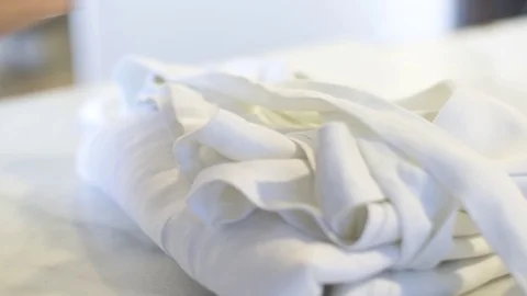 Close Up on white Fabrics on table Stock Footage 104819256
