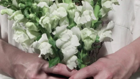 Close-Up Of White Flowers In Hands Stock Footage 169934279