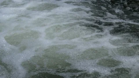 Close up of white foam from a fast river flow Stock Footage 292933470