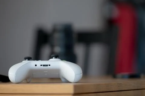 Close up of White generic Games Controller sat on a wooden table Stock Photos