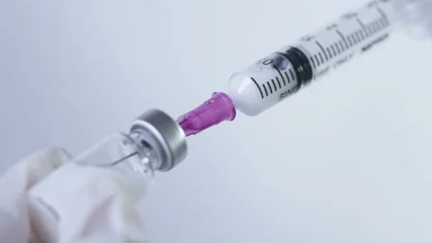 Close up white gloves hands holding injection needle suck out vaccine Stock Footage 157201056