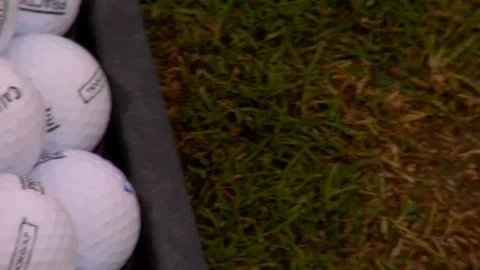 Close up white golf balls stacked up Stock Footage 125277547
