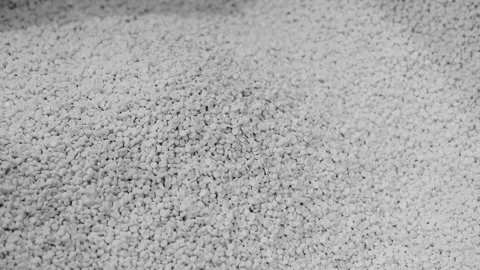 Close-up of white gravel surface. Texture details clearly visible. Natural, u Stock Footage 331861568