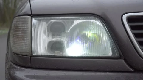 Close-up of white headlights on a car. running lights. Stock Footage 144078777
