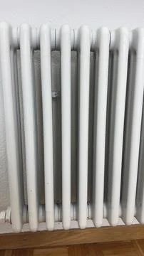 Close-up of white heating radiator after home repair and painting renovation Stock-Fotos