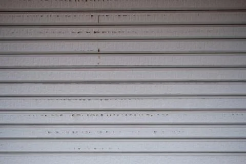 Close-up of a white horizontal metal security shutter texture background Stock Photos