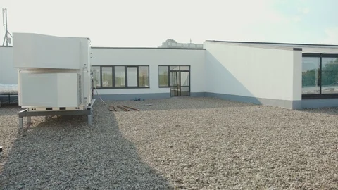 Close up of a white house being built sunset sunlight project factory building Stock Footage 95926940