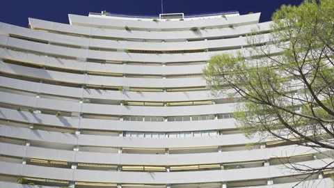 Close up of the white, large, pyramid-shaped building in the Marina Baie des Vídeos de archivo 314055234