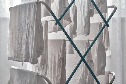 Close up of White Laundry hanging on a Clothes Airer Stock Photos