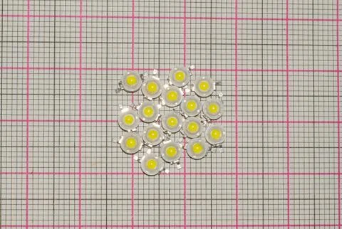 Close up of white leds on a graph paper. One watt white leds Stock Photos