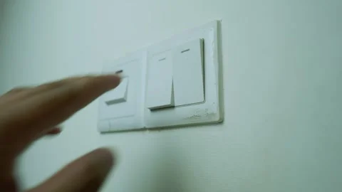 Close-Up of White Light Switch on Wall Stock Footage 317737342