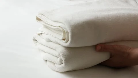 Close up to white linen bed while housekeeping make up room Video stock 282335887