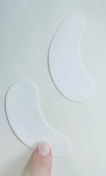 Close up of white lint free hydrogel eye patches for lash extensions on a whi Stock Photos