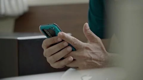 Close up of white man hand holding a mobile phone at vintage coffee shop Stock Footage 279005627