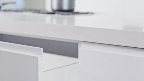 Close up of a white modern luxury kitchen drawer closing slowly Stock Footage 112107666