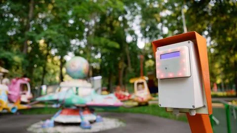Close-up of white orange electronic ticket validation terminal with glowing r Stock Photos