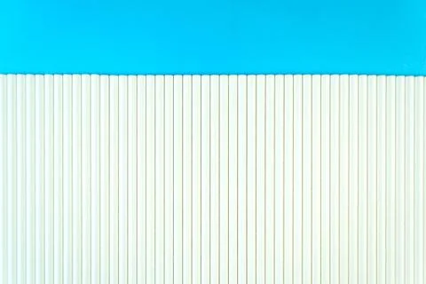 Close up white paper straw pattern on blue background. Flat lay cocktail tube Stock Photos