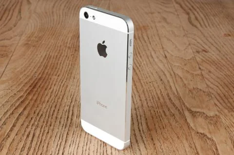 Close-up white phone on the table Stock Photos