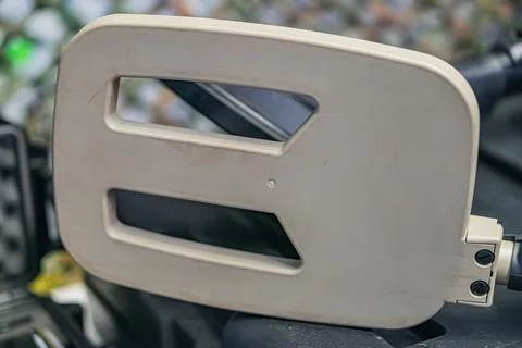 Close-up of a white, plasticcomposite mine detector component with cutouts an Foto stock