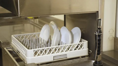 Close up, white plate on basket in automatic dishwasher machine for industrial Stock-Footage 103578189