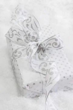 Close up of white present box with silver ribbon for christmas on white backg Stock Photos