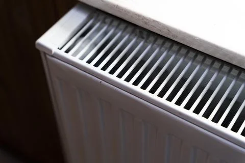 Close-up of a white radiator for heating with a sleek design, showcasing modern Stock Photos